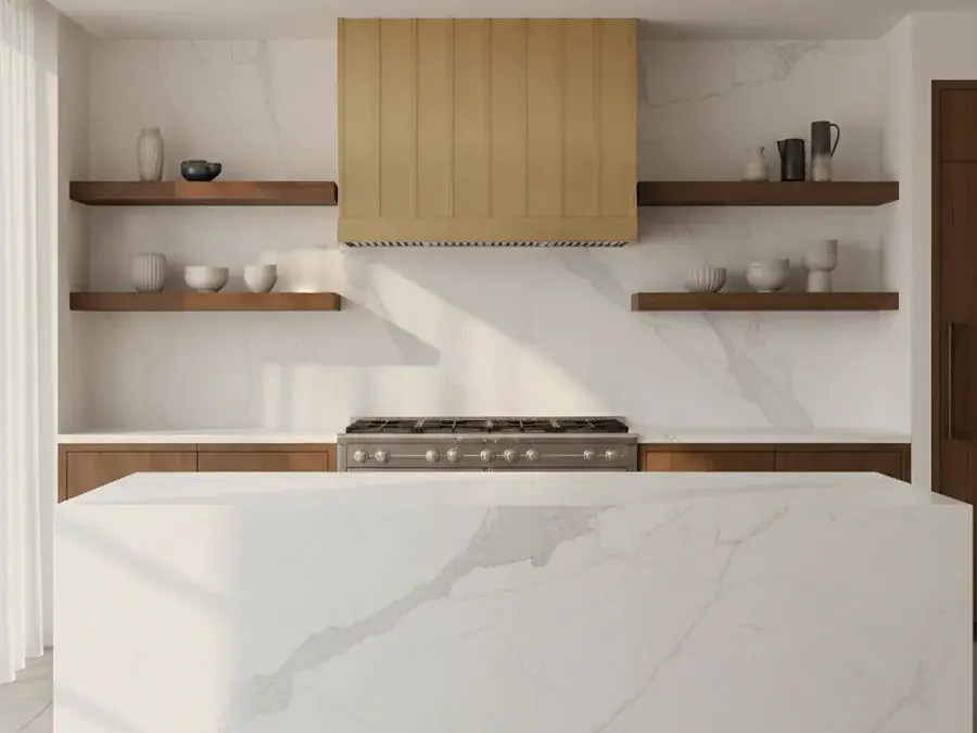 Luxury kitchen with full-height white quartzite backsplash extending floor-to-ceiling behind a stainless gas range