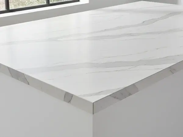 Statuario-style porcelain slab with soft grey and gold veining, matte honed finish